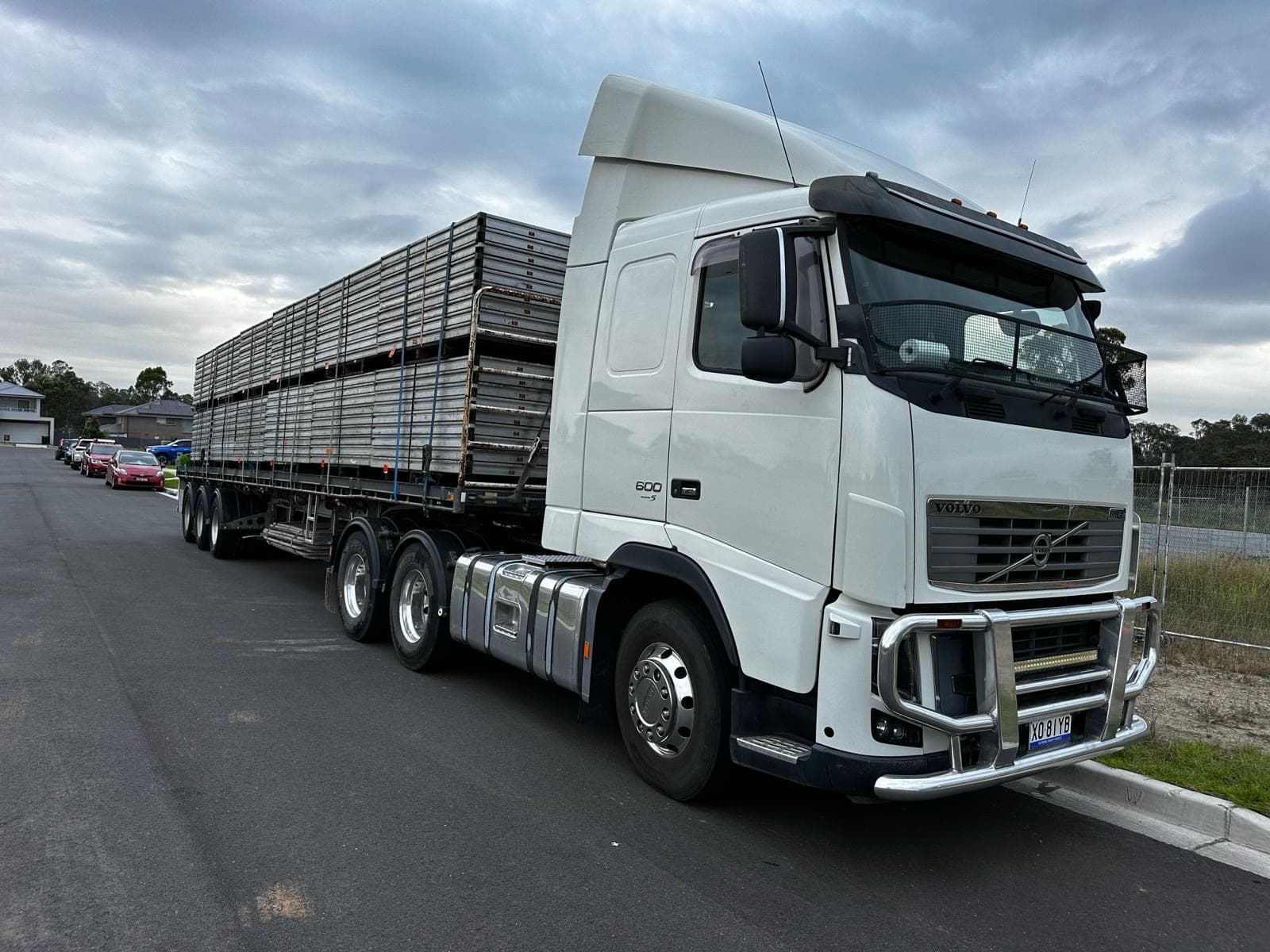 Quick Cargo flat-top semi loaded with event staging and scaffolding