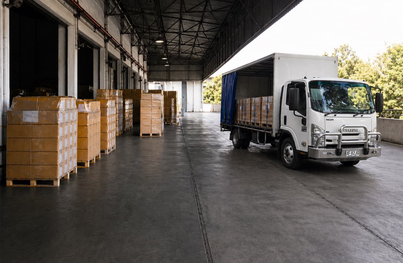 Quick Cargo truck loaded with palletised freight at a depot for a dedicated full truckload run